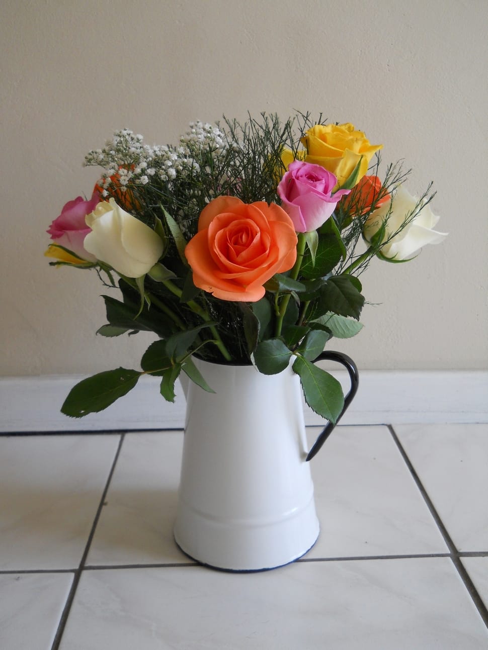 assorted flowers in white vasse preview