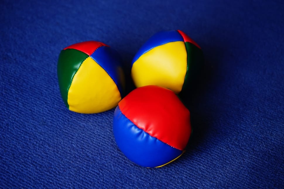 three blue yellow and green ball preview