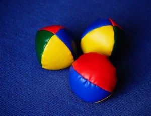three blue yellow and green ball thumbnail