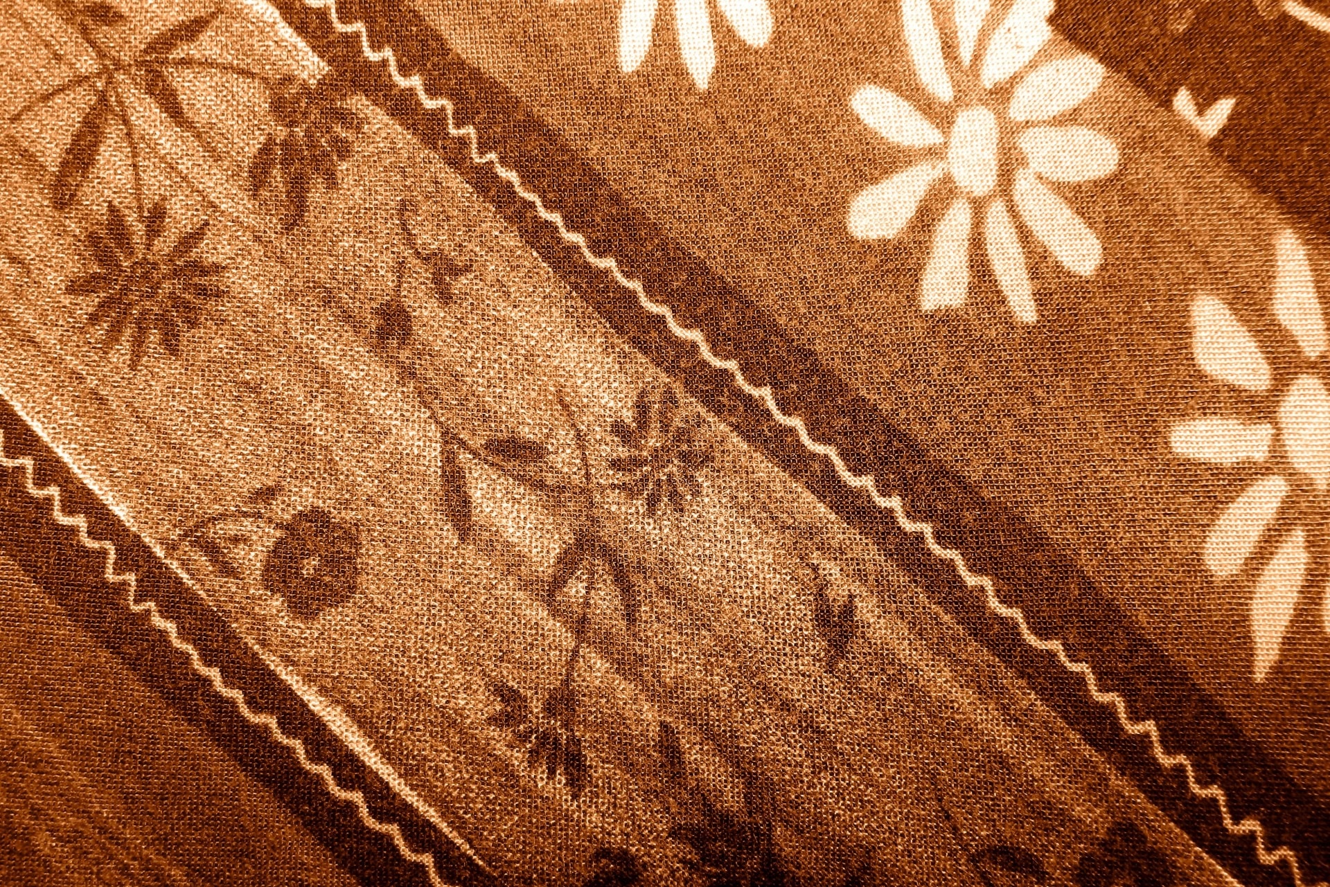brown black and white floral textile