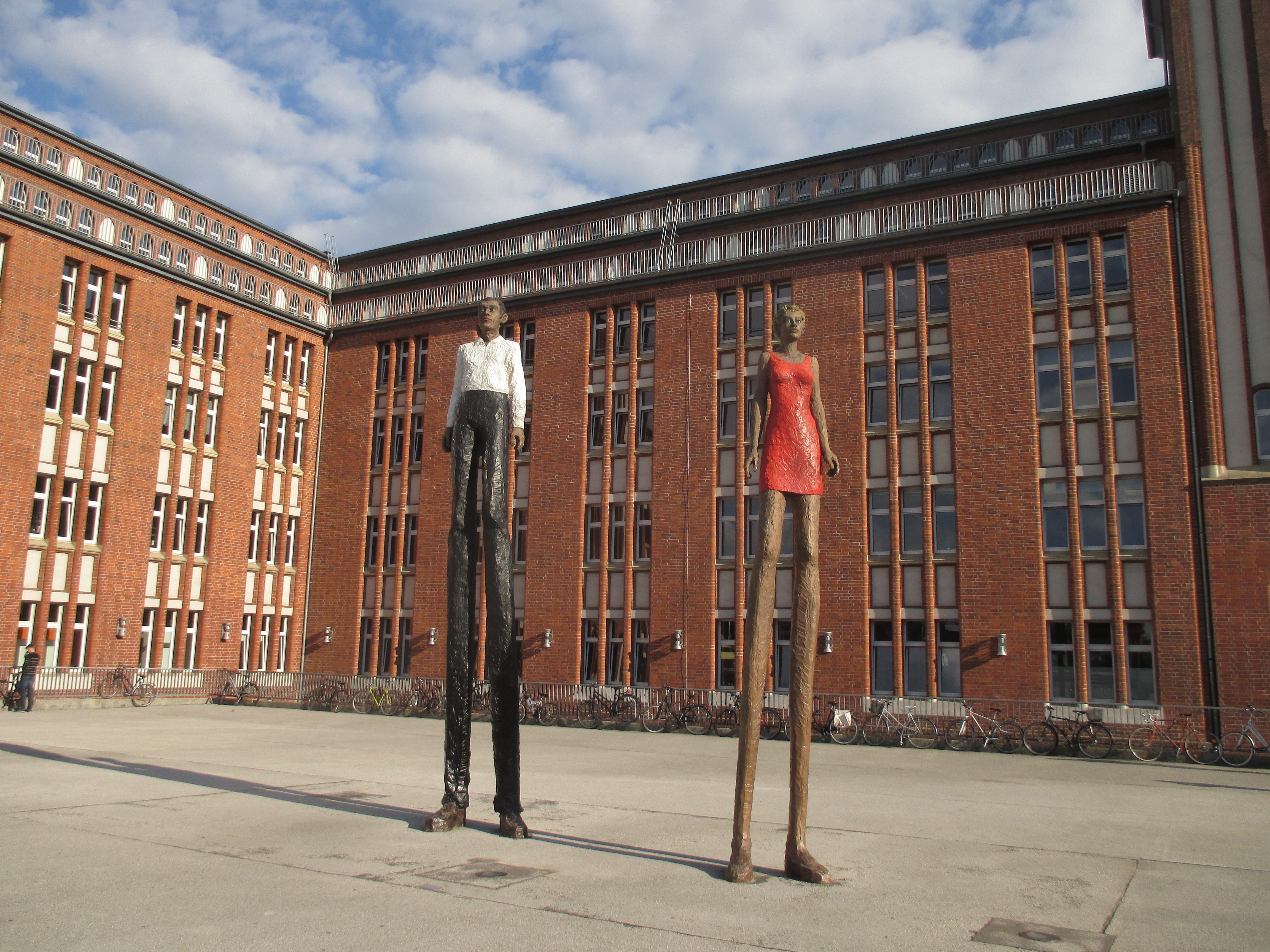 photo of a man and woman statue on building