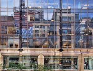 clear glass building reflecting high rise commercial building thumbnail