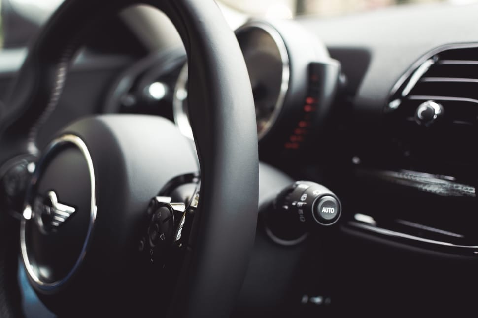 black leather Mini Cooper steering wheel in tilt shift lens  photography preview