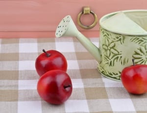 3 red apple fruits and watering can thumbnail