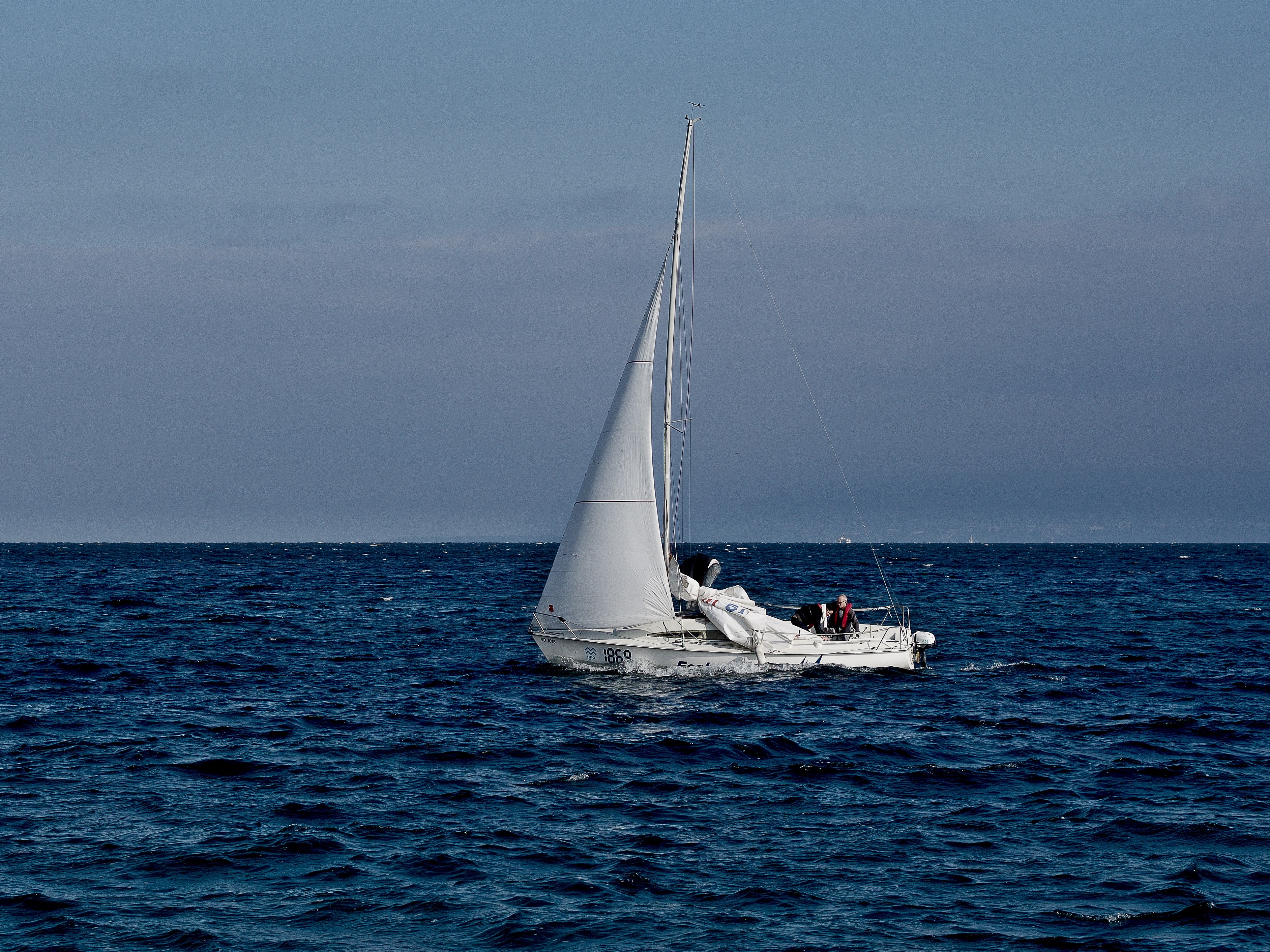 white sailing boat