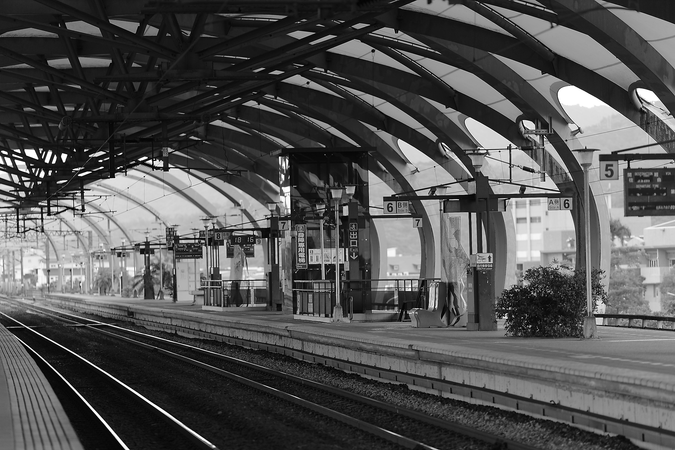 train station in grayscale photo