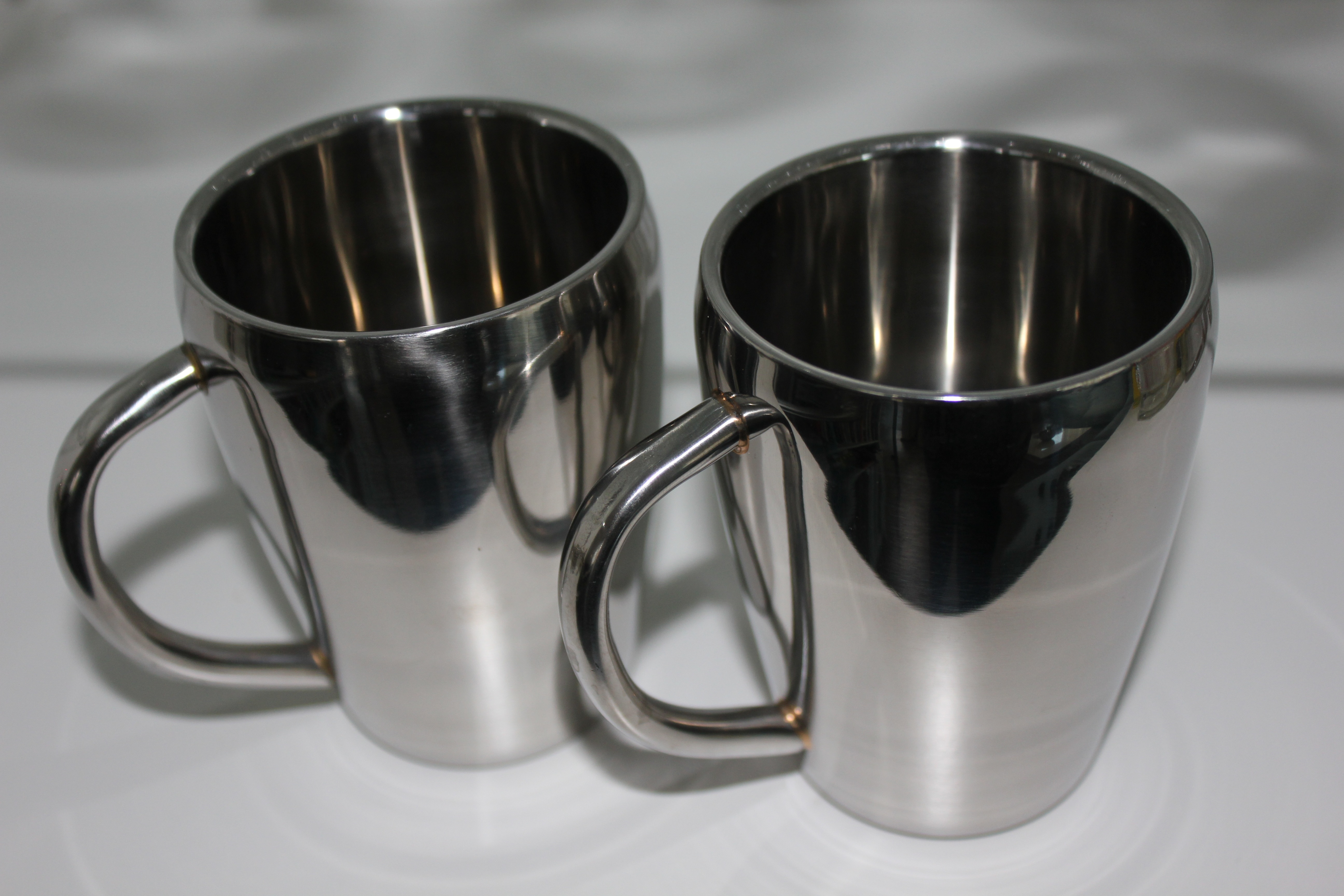 2 stainless steel mugs