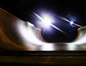 skateboard robb field beside light posts during nighttime thumbnail