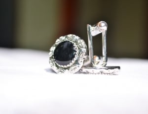 pair of silver and black earrings thumbnail