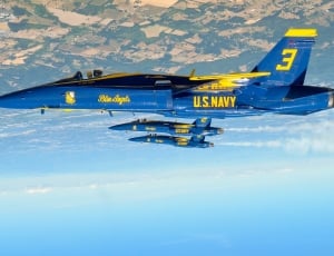 blue and yellow U.S. Navy plane thumbnail