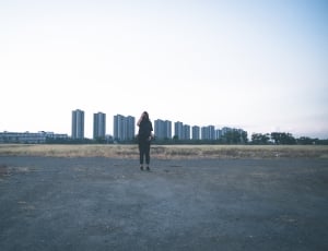 man standing on gray floor during daytime thumbnail
