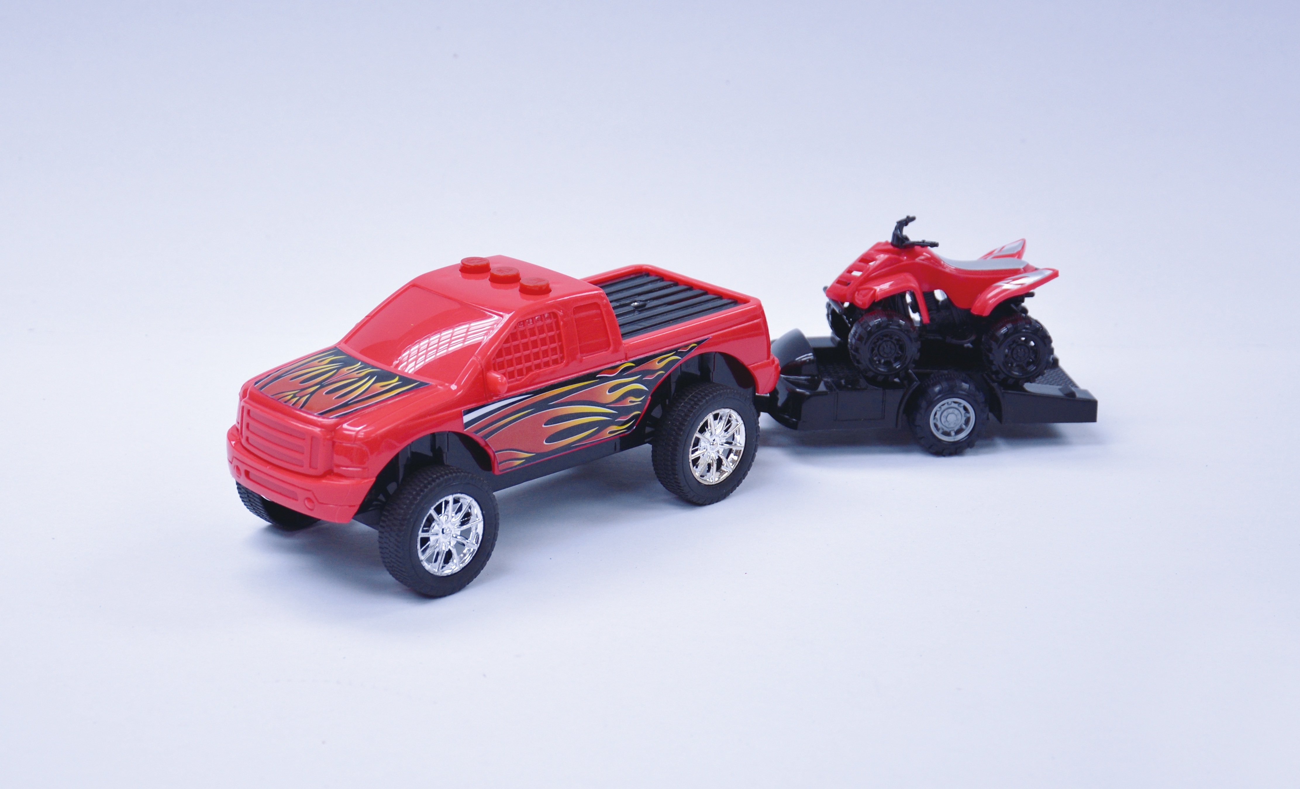red rc toy truck and atv quad bike