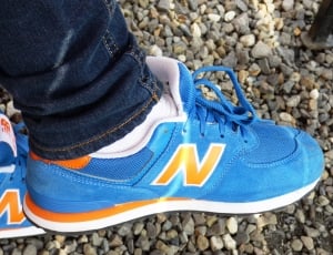 blue and orange new balance low top sneakers thumbnail