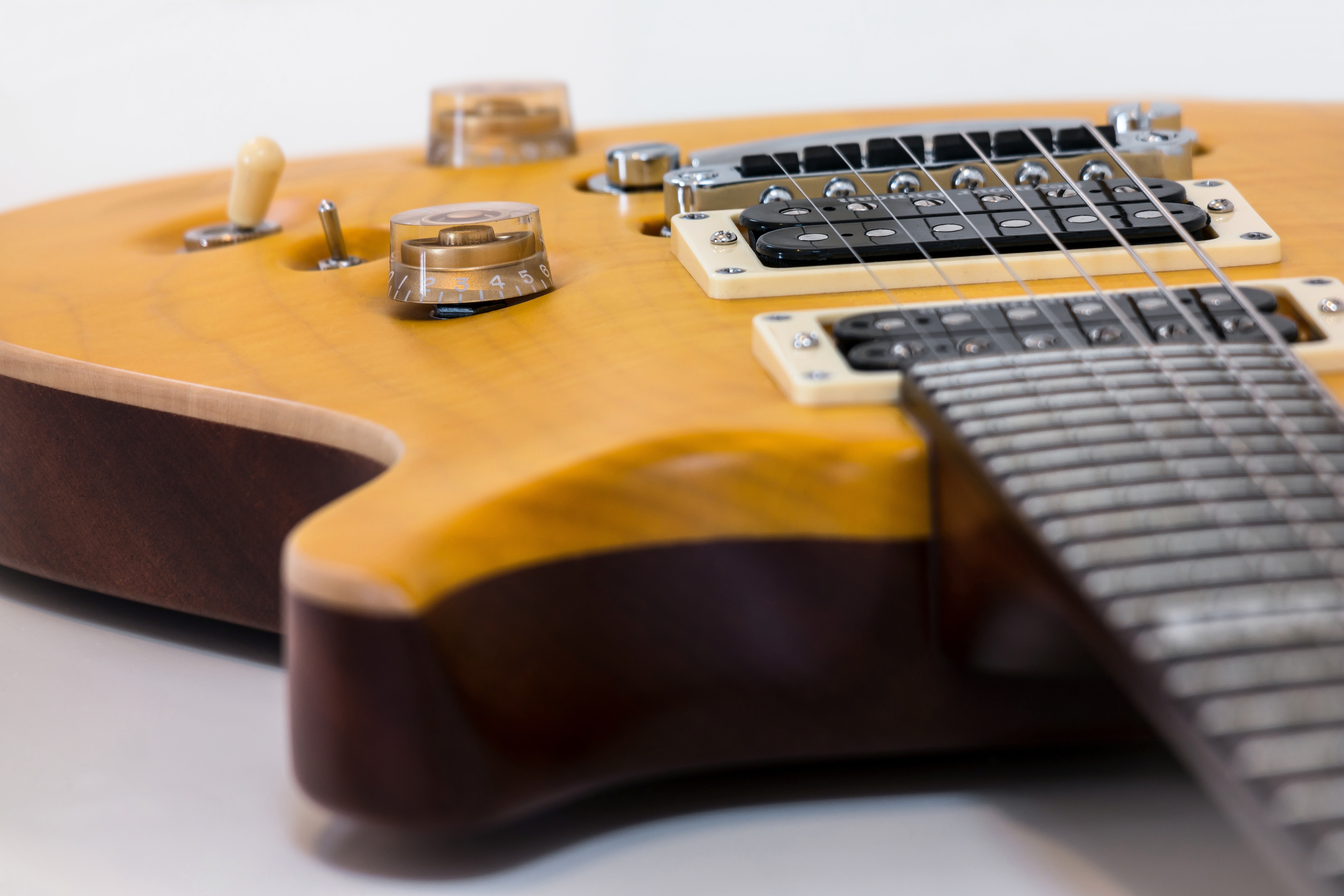 brown 6 string electric guitar