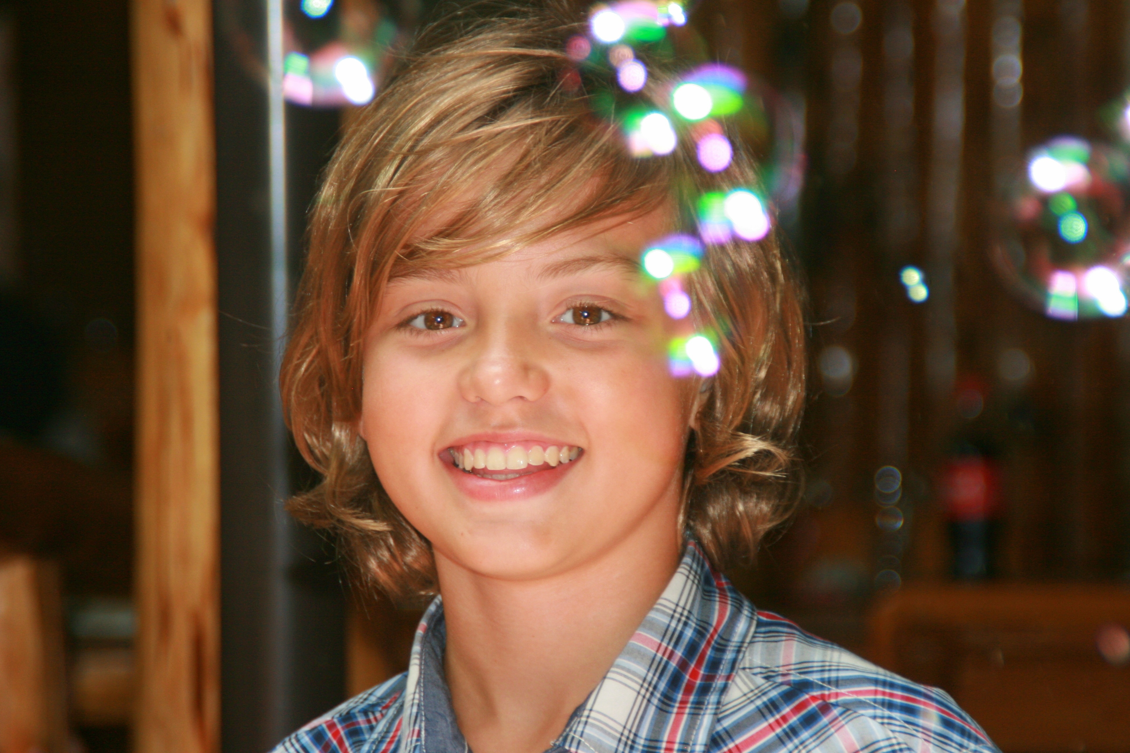 boy wearing white and blue plaid collared shirt