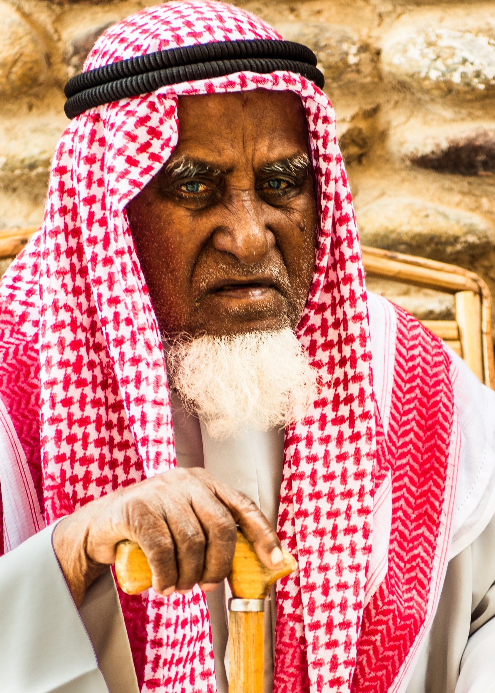 man wearing red and white kifyeh